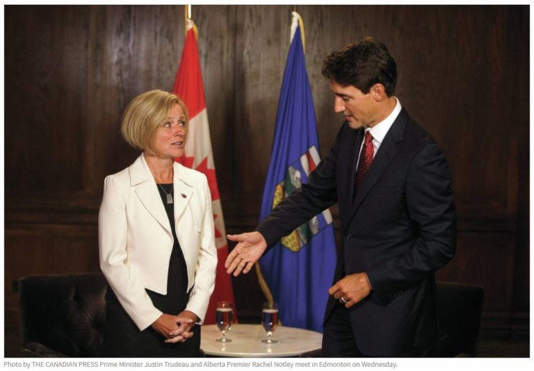 rachel-notley-justin trudeau-awkward-handshake-tmx-pipeline