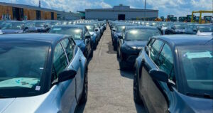 fisker ocean suvs in parking lot waiting for shipping