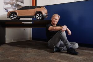 henrik fisker in front of ocean suv model